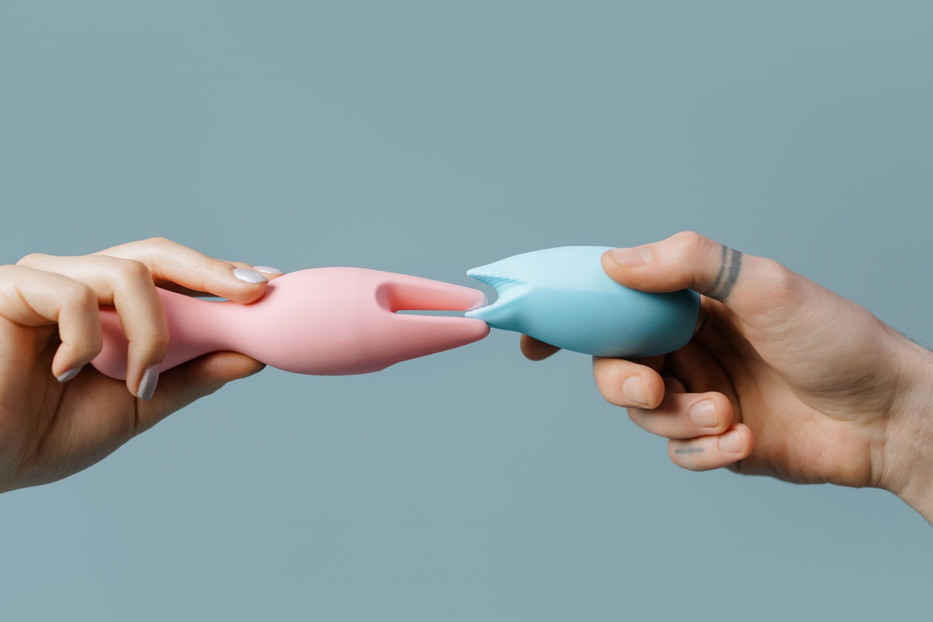 Colorful vibrators arranged on a bright yellow background, symbolizing diverse pathways to pleasure discovery