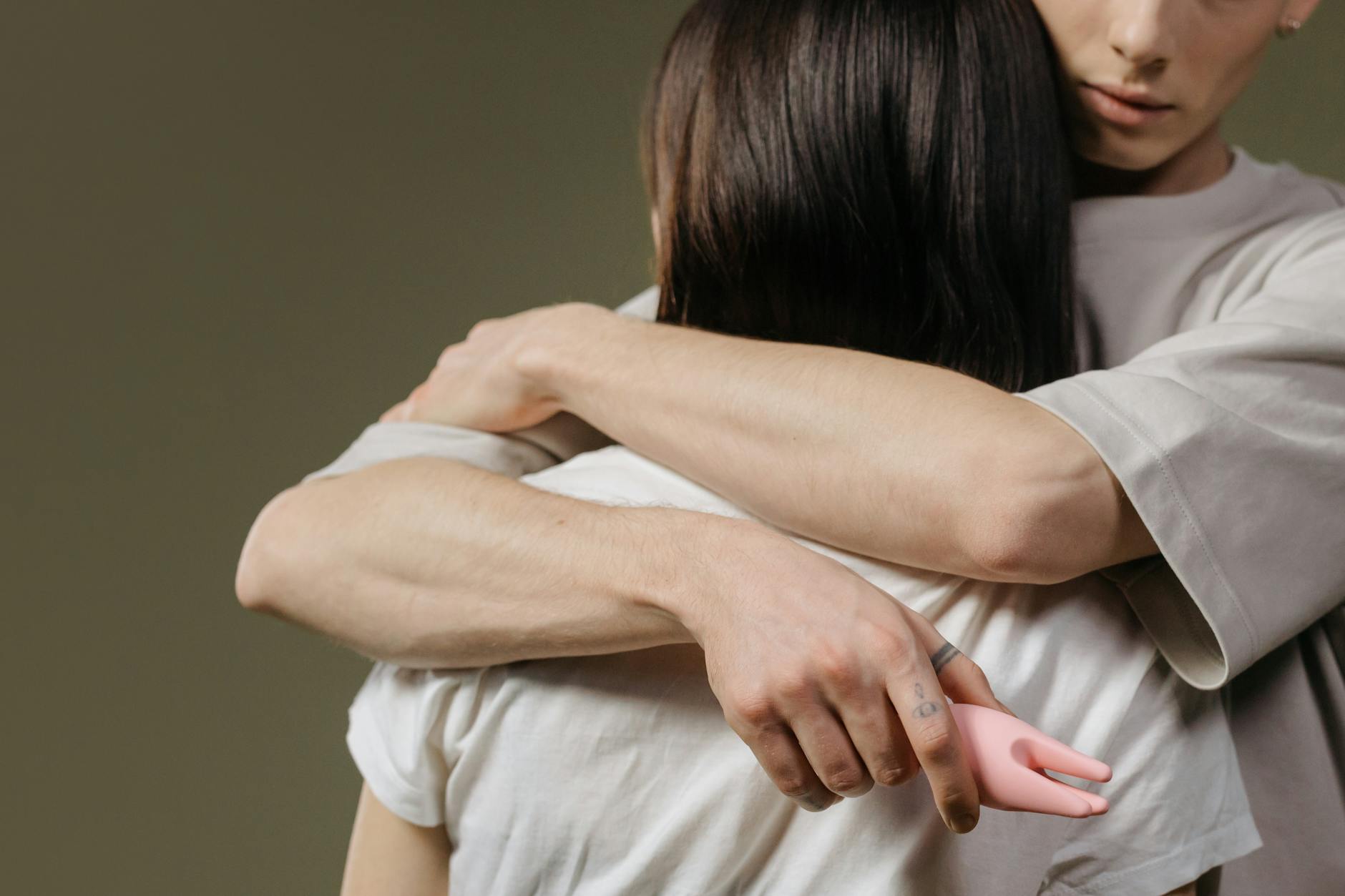 A couple embracing closely, showing intimate connection and communication.