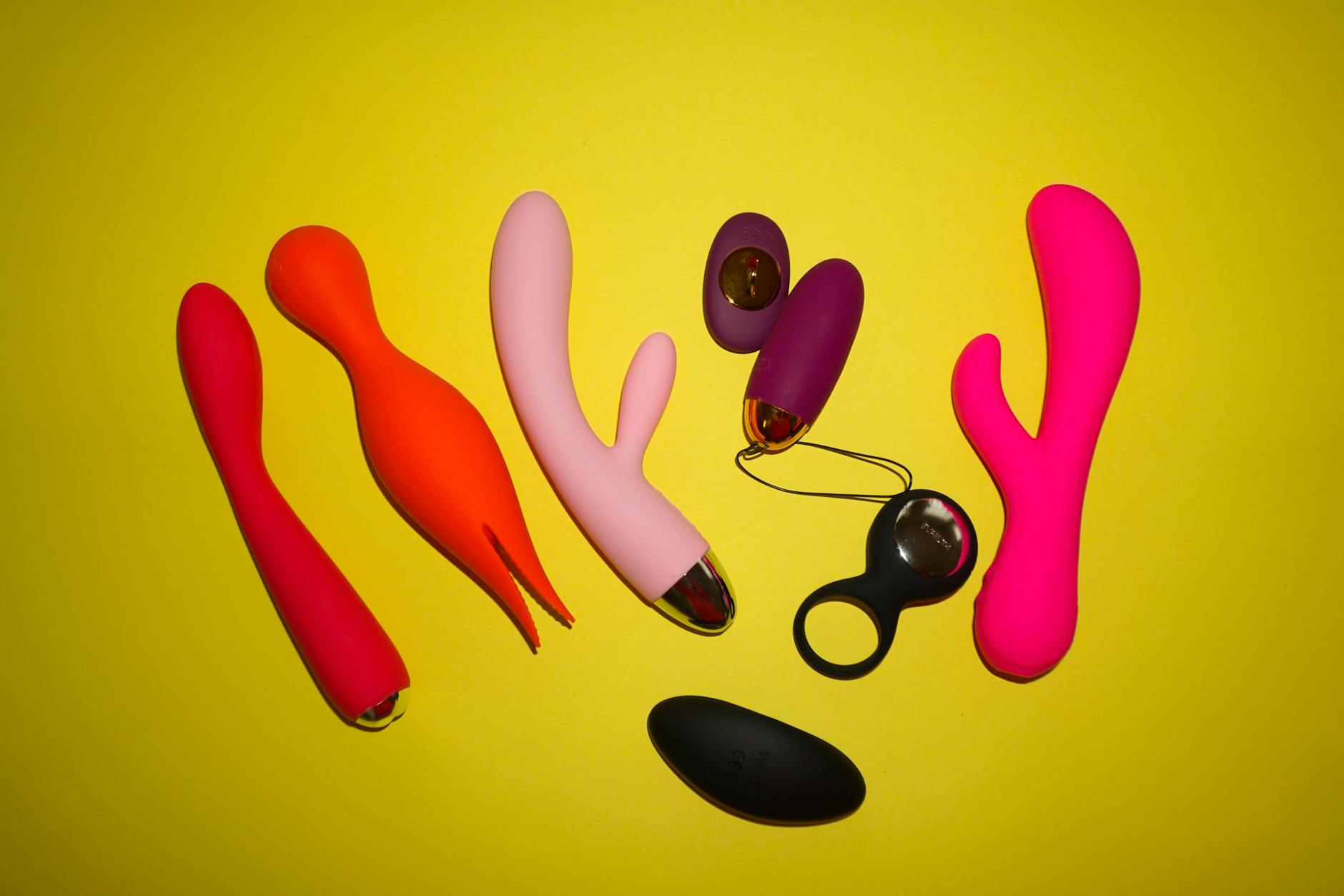 Hands holding a sleek blue vibrator, representing gentle pelvic floor recovery